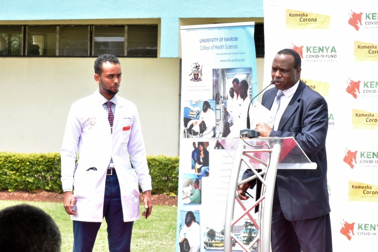 College of Health Sciences Principal, Prof. James Machoki welcomes Association of Medical Students of University of Nairobi chairman Amir Mumin to make his remarks during the occasion.