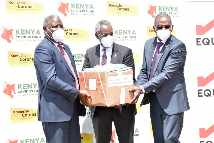 UoN Vice Chancellor, Prof. Stephen Kiama(C) receives PPEs donation from Dr James Mwangi Equity Group Managing Director and CEO (L) and Principal Administrative Secretary Office of the President and Secretary of the Kenya COVID-19 Fund Board, Kennedy Kihara(R).