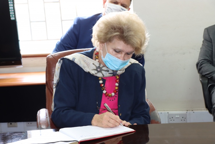 Signing of visitors book.