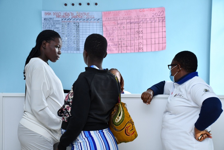 Mothers and nurses at the new nursing station for the new maternity wing.