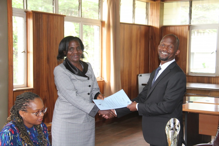Faculty of Health Sciences Dean Prof. George Osanjo(R) with Dr. Callen Onyambu, Chair Department of  Diagnostic Imaging and Radiation Medicine during the signing of the 2022/2023 performance contract.