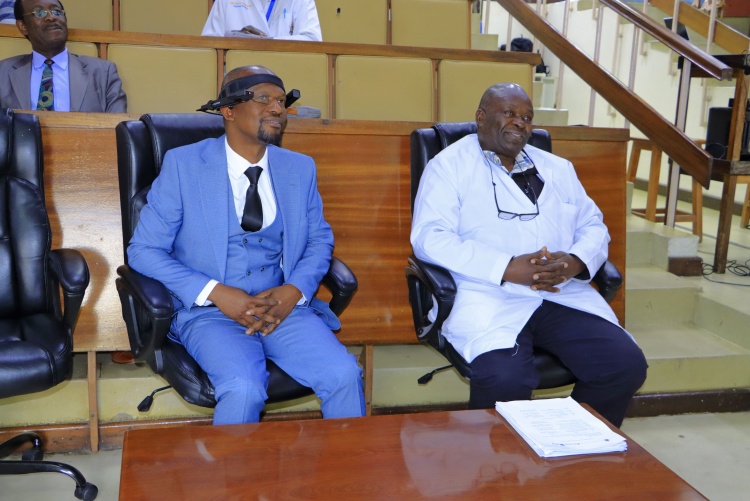 Faculty of Health Sciences Dean, Prof. George Osanjo (left) and Associate Dean, Undergraduate, Prof. C.F. Otieno (right) follow proceedings during Proximie digital surgical education integration session.