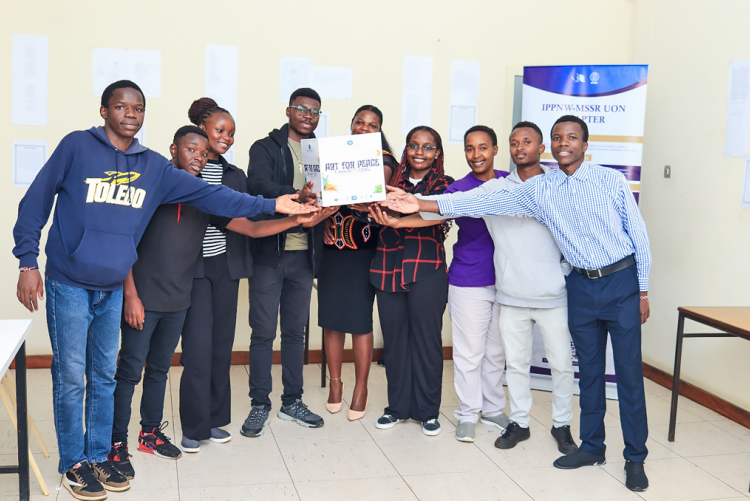 Part of the contestants, partners, and the Organizing team celebrate the launch of the Art for Peace Contest Exhibitions at the Library Area, giving the walls a mouth to speak. IPPNW-MSSR at the UoN.