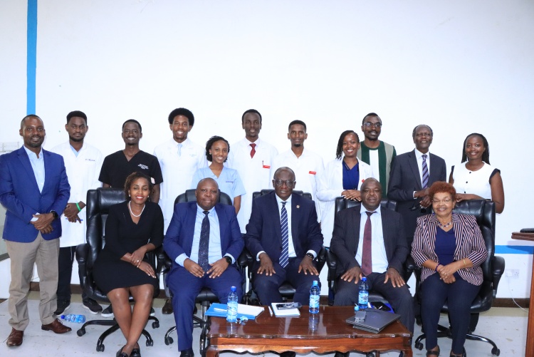 Director General for Health Dr. Patrick Amoth and KMPDC CEO and Registrar Dr. David Kariuki flunked by  KMPDC inspection committee members and FHS medical students.