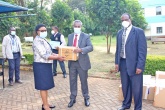 University of Nairobi Vice Chancellor, Prof. Stephen Kiama hands over a donation of COVID-19 pandemic containment items to University Health Services Chief Medical Officer Dr. Lucy Muhia. Looking on is Prof. James Machoki, College of Health Sciences Principal.