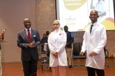 The Deputy Vice Chancellor, The Dean and a new student during the white coat ceremony 