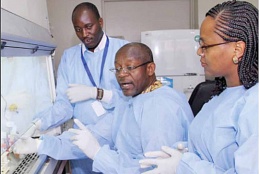  Prof. Omu Anzala, (center), Dr. Marianne Mureithi (left), and Laboratory Technologist Mr. Patrick Mwaura in the KAVI-ICR laboratory.