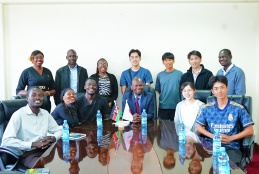A group photo of Faculty of Health Sciences Dean, Prof. George Osanjo with five Japanese students who are on an exchange program at the faculty together with their host students.